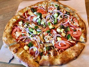 Veggie pizza with rosemary herb crust at Pizza Studio in Tukwila