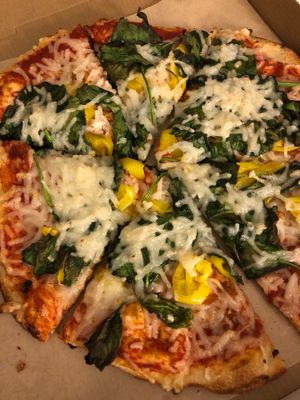 Red sauce, spinach & banana peppers  at Pizza Studio in Tukwila