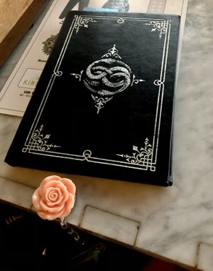 The check came in this book! at Kindred in San Diego