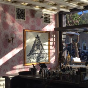 the goth-y artwork with the pink wallpaper - love it! at Kindred in San Diego