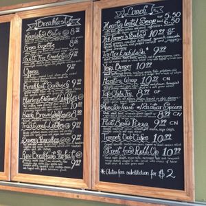 Restaurant Menu on their wall at Wild Rice Vegan Cafe in Watertown