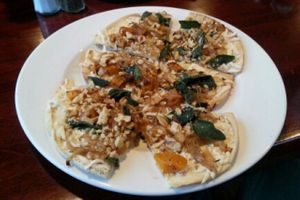 Flatbread pizza w/ butternut squash, sage leaf, walnuts & vegan cheese at Wild Rice Vegan Cafe in Watertown