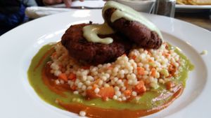 Tempeh crab cakes and Israeli couscous at Wild Rice Vegan Cafe in Watertown