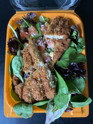 ‘Chicken’ Caesar Salad (power greens, garbanzo beans, diced tomatoes, Parmesan ’cheese’, and your choice of CRISPY or grilled ‘chicken’ strips) at Plant Power Fast Food - Ocean Beach in San Diego