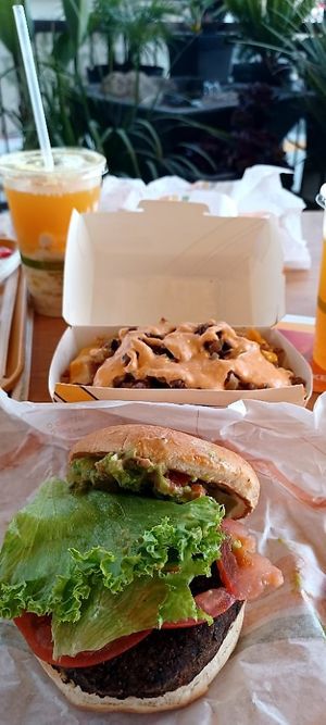 Black Bean Guac Burger/Iconic spuds at Plant Power Fast Food - Ocean Beach in San Diego