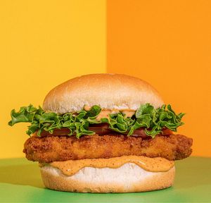 'Chicken' Sandwich: Choice of crispy or grilled 'chicken' patty lettuce, tomato, and sauce of your choice at Plant Power Fast Food - Ocean Beach in San Diego