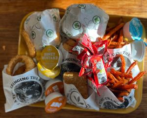Onion Rings, Sweet Potato Fries, hash browns, sauces.  at Plant Power Fast Food - Ocean Beach in San Diego