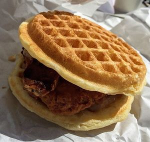 Chicken 'n' Waffle Sandwich with maple bacon syrup. Indulgent and delicious. at Plant Power Fast Food - Ocean Beach in San Diego