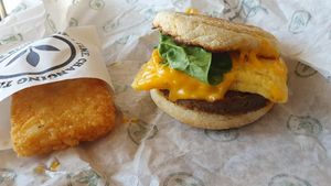 Sausage and egg muffin with hash brown at Plant Power Fast Food - Ocean Beach in San Diego
