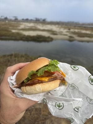 Bbq burger with onion rings and vegan bacon  at Plant Power Fast Food - Ocean Beach in San Diego