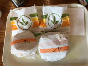 Chicken and waffles and sausage egg muffin at Plant Power Fast Food - Ocean Beach in San Diego