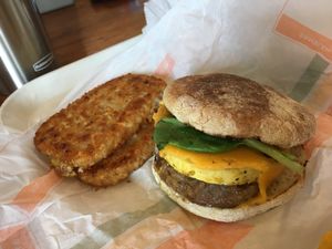Sausage egg muffin and 2 hash browns  at Plant Power Fast Food - Ocean Beach in San Diego