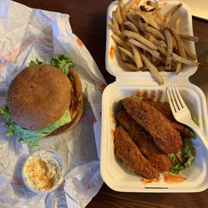 Buffalo wings, fries, and the barbecue and onion ring burger. 🤤 at Plant Power Fast Food - Ocean Beach in San Diego