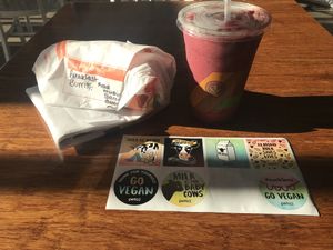 Breakfast burrito with a ton of adds, smoothie and sticker set  at Plant Power Fast Food - Ocean Beach in San Diego