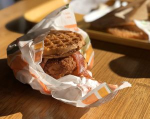 Chicken and Waffle Breakfast Sandwich with Maple Aioli and “Bacon"  at Plant Power Fast Food - Ocean Beach in San Diego