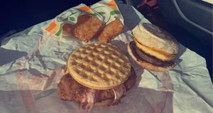 chicken & waffles & sausage, egg, & cheese muffin at Plant Power Fast Food - Ocean Beach in San Diego