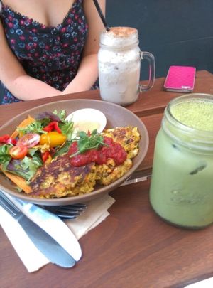 Vegetable fritters with homus & salad and drinking iced matcha & chai at Full Of Life Organics in Toowoomba