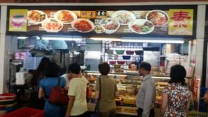 lunch time crowd queuing to order their food at Ming Shan Vegetarian Food Stall in Central Singapore