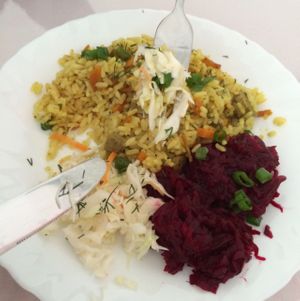 rice with salad at Laiminga Diena in Siauliai