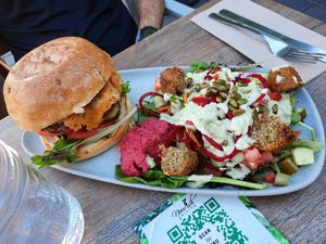 Boss burger (with cheese but can sub vegan cheese), falafel salad at Nourish Bistro in Banff