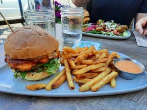 Kimchee burger (with cheese but can sub vegan cheese), harissa fries at Nourish Bistro in Banff