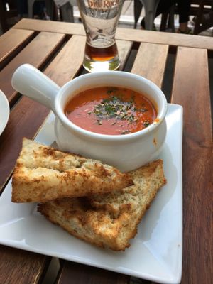 tomato soup with vegan focaccia  at Nourish Bistro in Banff