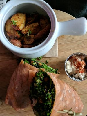 Tofu caesar wrap with potato wedges at Nourish Bistro in Banff