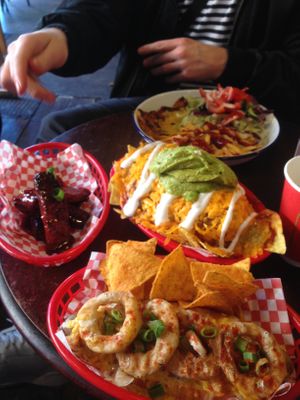 Ribs, nachos, hot dog (hidden below nachos and onion rings) at Vx in Bristol