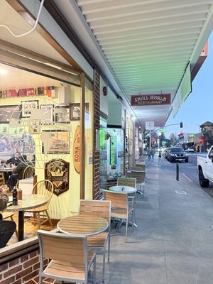 Outdoor tables on the sidewalk to dine al fresco   at Small World in Napa