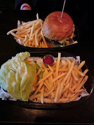 Vegan burger in lettuce bun versus my friends meat burger at the top at The Rabbit Hole in Hakuba