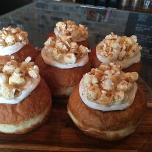 Caramel popcorn vegan donut with a maple drizzle  at All-Time Coffee Co in Mermaid Beach