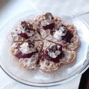 Vegan waffle with cherry, cream and chocolate at Koffie Engel at Koffie Engel in Berlin