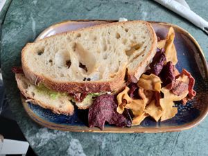 Sourdough sandwich with vegan feta, avocado and sun-dried tomatoes at Qoozies in Chesterfield