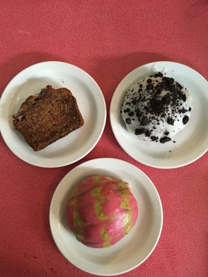 Vegan banana bread, vegan Oreo doughnut with vanilla custard filling, vegan raspberry and pistachio doughnut with vanilla custard filling. at The Bagelry  in Liverpool