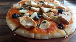 you can order a vegan pizza (change cheese to tofu) at My Little Cafe in Siem Reap