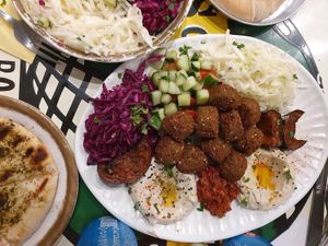 Falafel plate with falafel, tahini cream, Hoummus an three kinds of salad at L'as du Fallafel in Paris