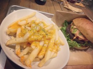 Cheesy fries and burger at Ain Soph.Ripple Kabukicho in Tokyo