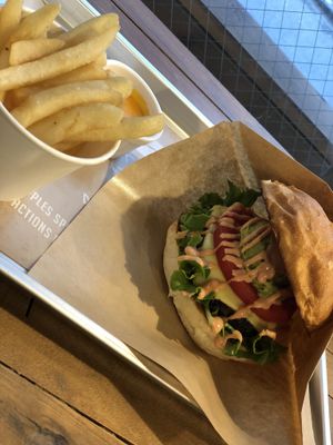 Burger and fries with cheese sauce at Ain Soph.Ripple Kabukicho in Tokyo