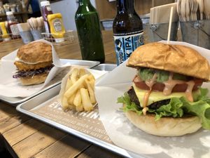 Cheeseburger, chicken burger, fries and beers. Yes!  at Ain Soph.Ripple Kabukicho in Tokyo