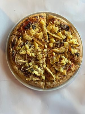 Vegan parmesan, chicken, pineapple, artichoke, onion & sun-dried tomato. at Ottimo Ristorante Italiano in Hobart