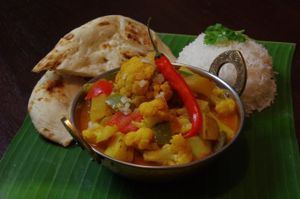 Aloo Gobi: Aloo (potatoes), Gobi (cauliflower), peppers, onions, and tomatoes. Vegan. at Dabbawalas in Basel