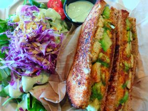 Grilled sandwich (avocado, nut cheez, and I added tempeh). Comes with side salad at Organically Twisted in Naples