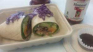 Avo-loco wrap, raspberry iced tea, and a "peanut butter cinnamon caramel raw chocolate cup". at Organically Twisted in Naples