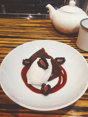  For our chocolate loving VEGgies out there. Vegan Chocolate Truffle Torte with Almond Date Crust, Blackberry Sauce, and Coconut Whipped Cream. Intensely satisfying. at Veg Cafe in Sacramento