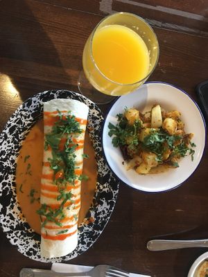 Breakfast burrito, hash browns and mimosa  at Veg Cafe in Sacramento
