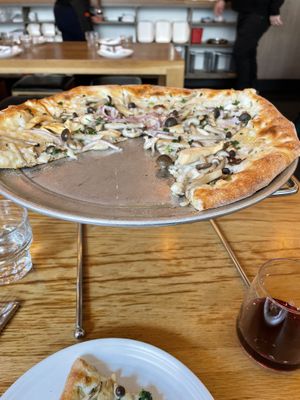 Pizza con fungi with vegan cheese.  Chianti in lower rh corner.  at Delarosa - Yerba Buena in San Francisco