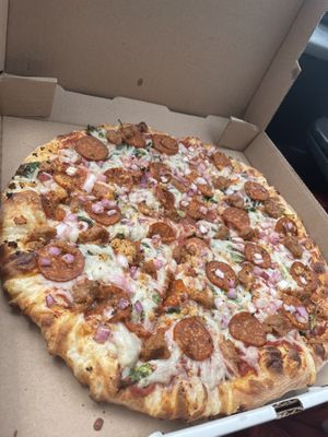 Vegan pepperoni and sausage, onion, and spinach   at Pizza Classics in San Antonio
