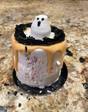 Birthday mini  spooky cake from October 2023 👻 A bit mangled from transit  but amazing 😭💖  at Vegan Treats Bakery in Bethlehem