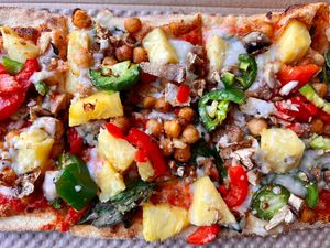 Vegan pizza! ⭐️ Lots of veggies, vegan cheese, spicy chickpeas, vegan beef and pineapple   at IAD - &pizza - CC in Dulles