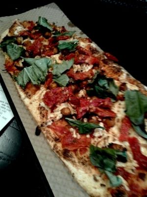 spicy chickpea, wild grain crust, spicy sauce, basil, sun-dried tomatoes  at IAD - &pizza - CC in Dulles